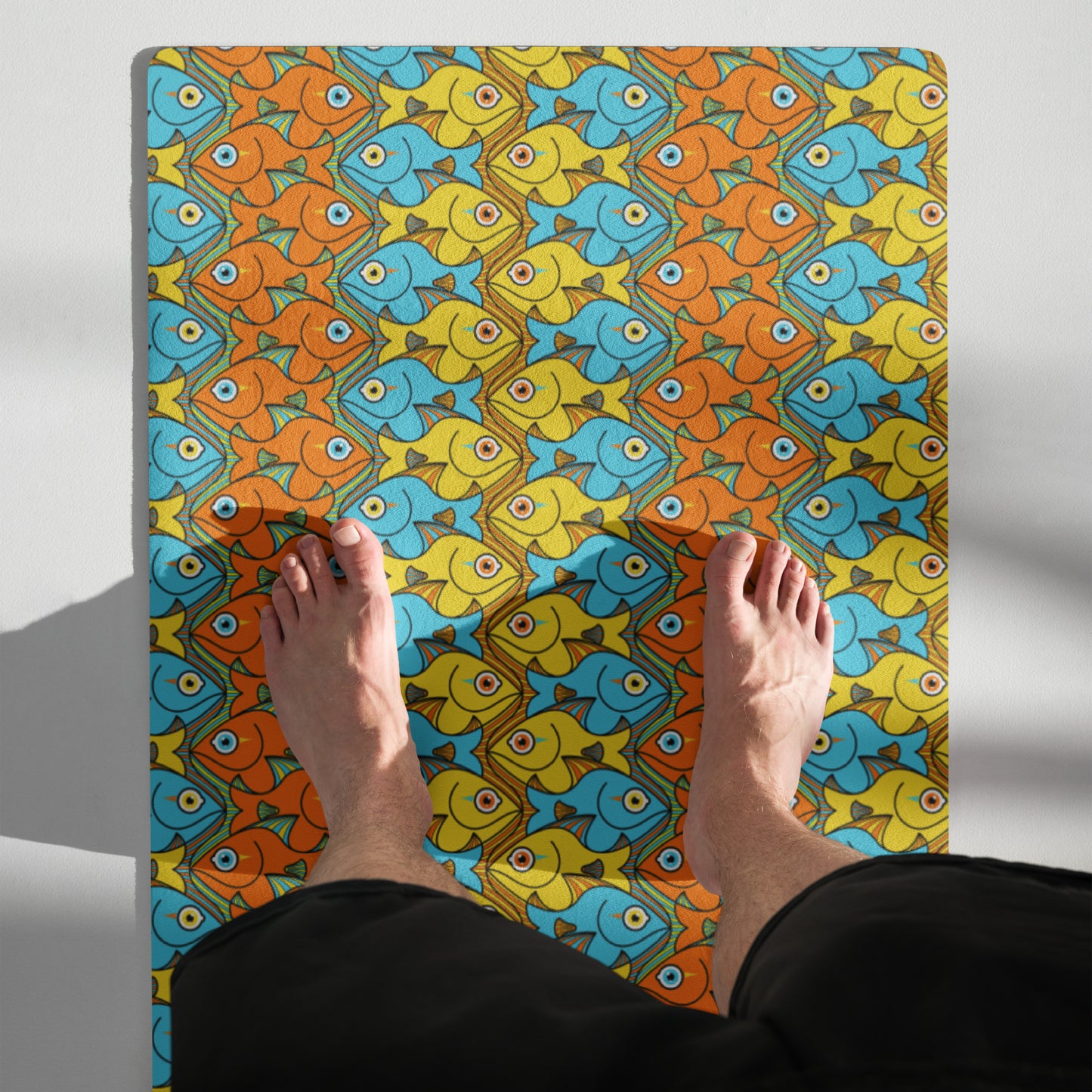 Smiling colorful fishes pattern Yoga mat. Top view