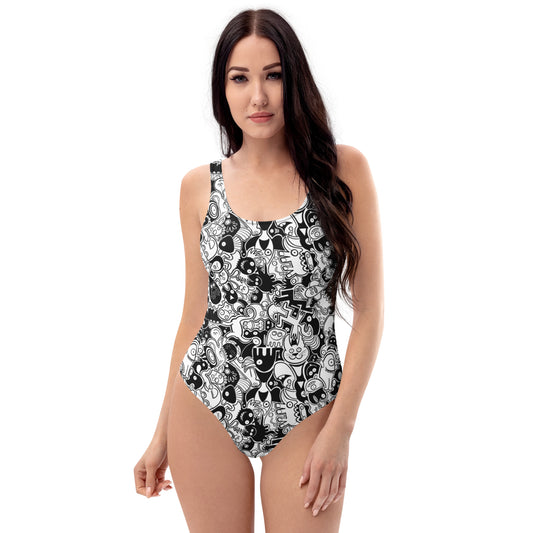 Joyful crowd of black and white doodle creatures One-Piece Swimsuit. Front view
