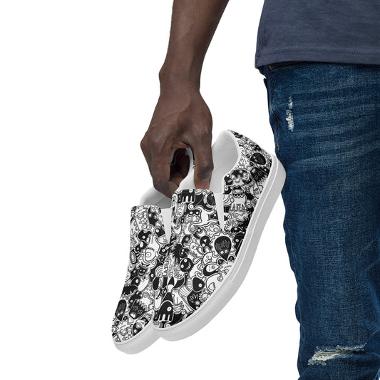 Joyful crowd of black and white doodle creatures Men’s slip-on canvas shoes. Lifestyle