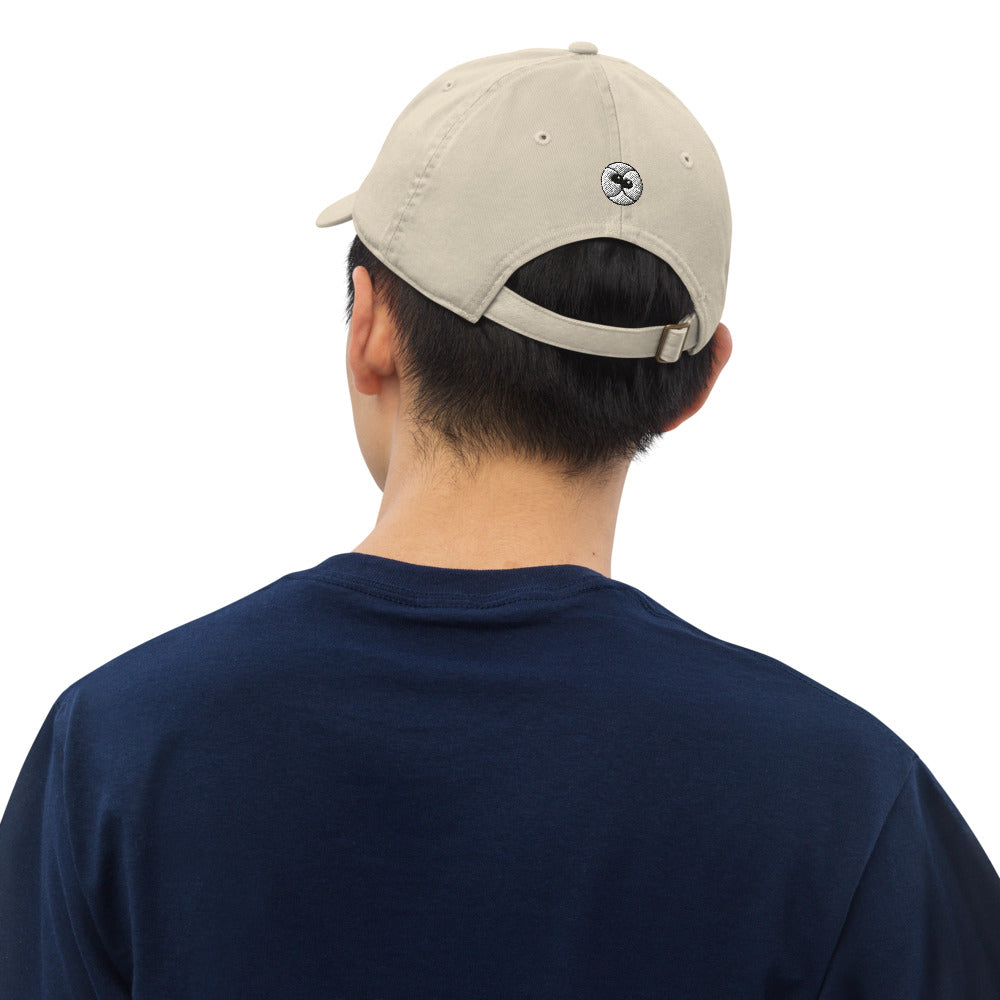 Young man wearing a Zoo&co branded Organic dad hat. Oyster. Back view