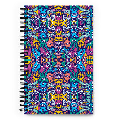 Whimsical design featuring multicolor critters from another world Spiral notebook. Front view