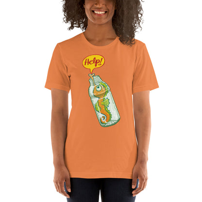 Beautiful woman wearing Unisex t-shirt printed with Seahorse in trouble asking for help while trapped in a plastic bottle. Burnt orange. Front view
