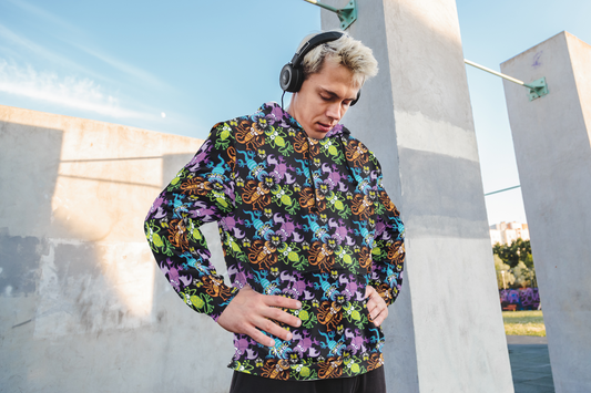 Man wearing a Zoo&co all-over print doodle art hoodie stretching outdoors — bold all-over print fashion
