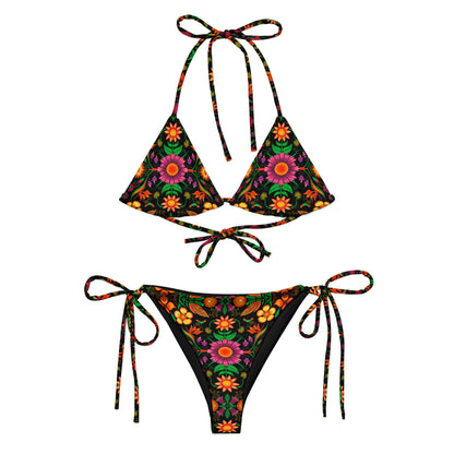 Wild flowers in a luxuriant jungle All-over print recycled string bikini. Flat view