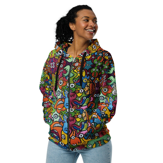 Woman modeling Doodle Planet unisex zip hoodie with colorful creature artwork and hands in the front pockets.