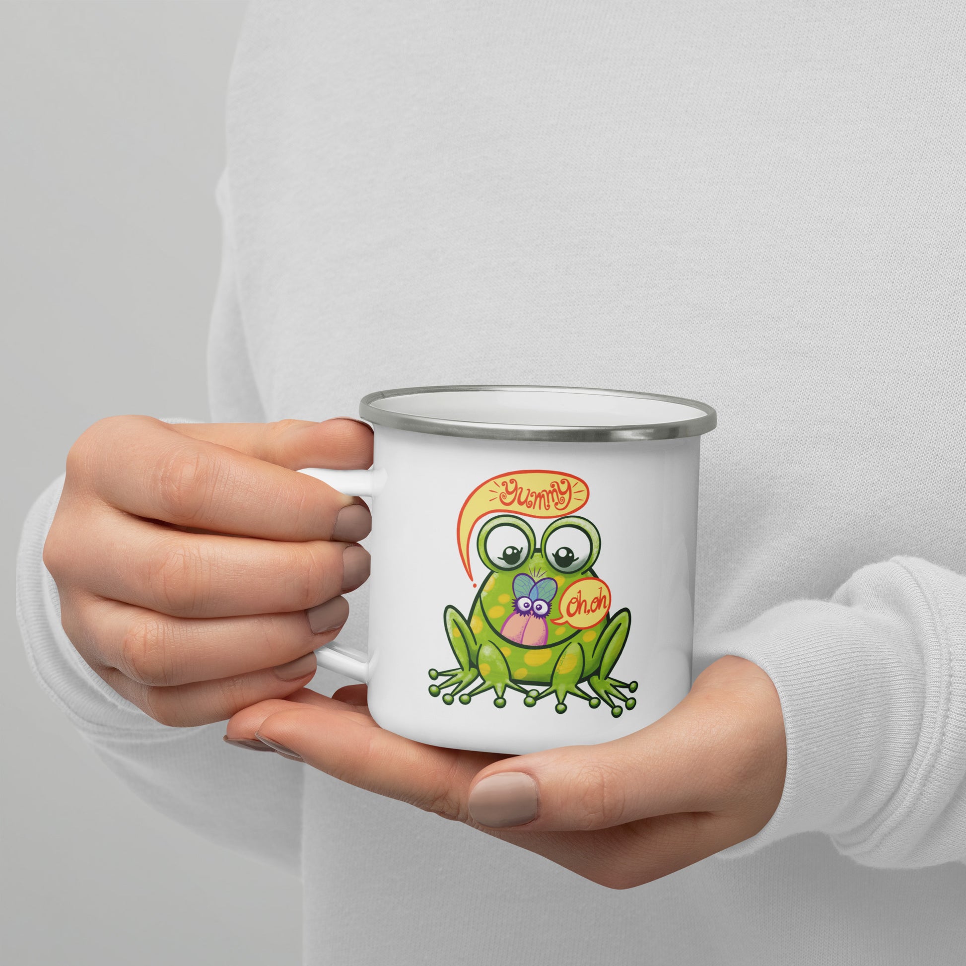 Mischievous frog hunting a delicious fly Enamel Mug. Lifestyle