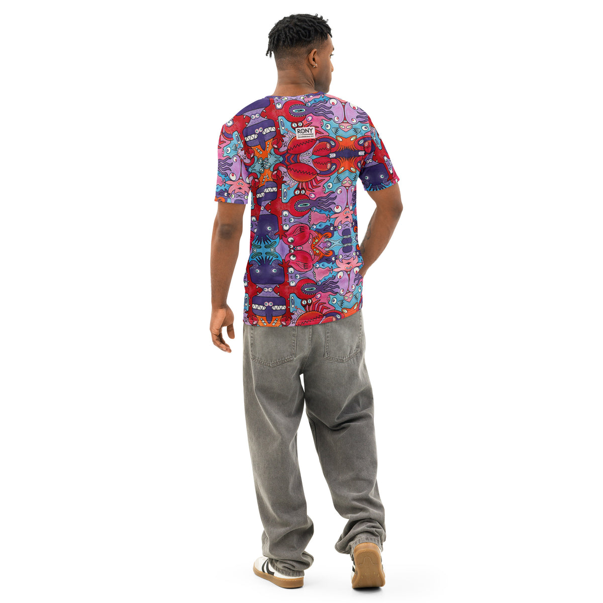 Man modeling Eyes See the Unseen psychedelic cotton t-shirt from behind, showing the colorful creature print.