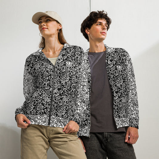 Man and woman wearing Playful Power of Great Doodles unisex track jackets with contrasting black-and-white doodle art.