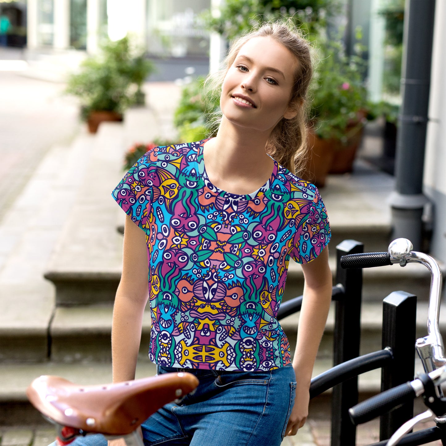 Whimsical design featuring multicolor critters from another world All-Over Print Crop Tee. Lifestyle