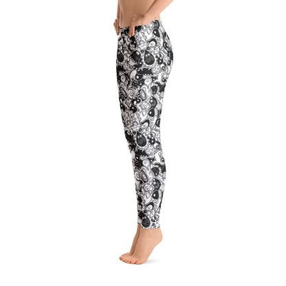 Joyful crowd of black and white doodle creatures Leggings. Side view