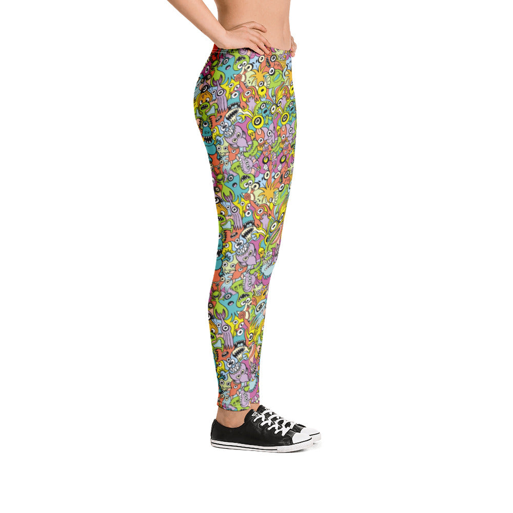 Funny monsters fighting for the best spot for a pattern design Leggings. Side view