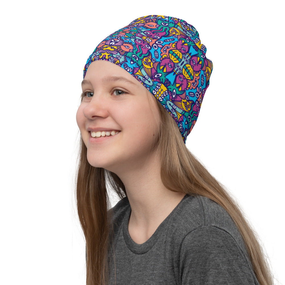 Young girl wearing a Neck Gaiter all-over printed with Whimsical design featuring multicolor critters from another world