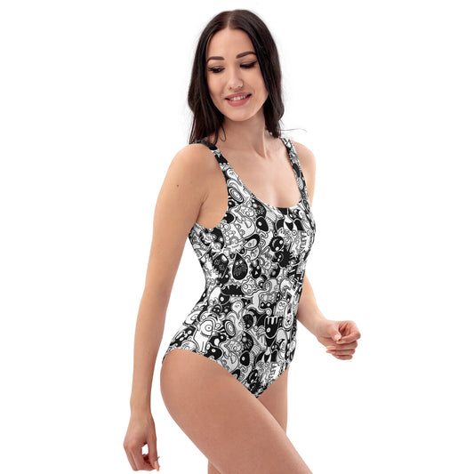 Joyful crowd of black and white doodle creatures One-Piece Swimsuit. Side view