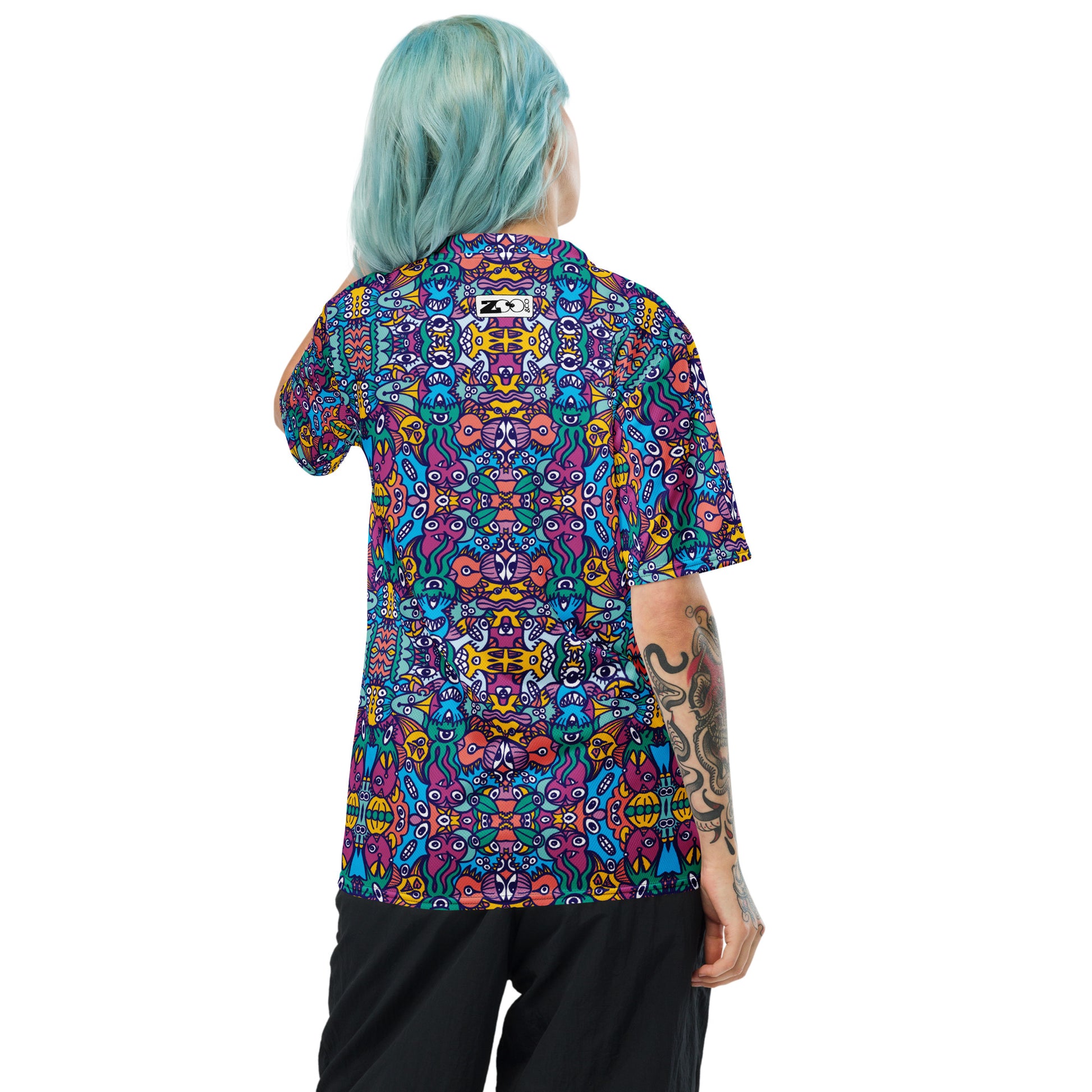 Woman wearing Whimsical design featuring multicolor critters from an alien world Recycled unisex sports jersey. Back view