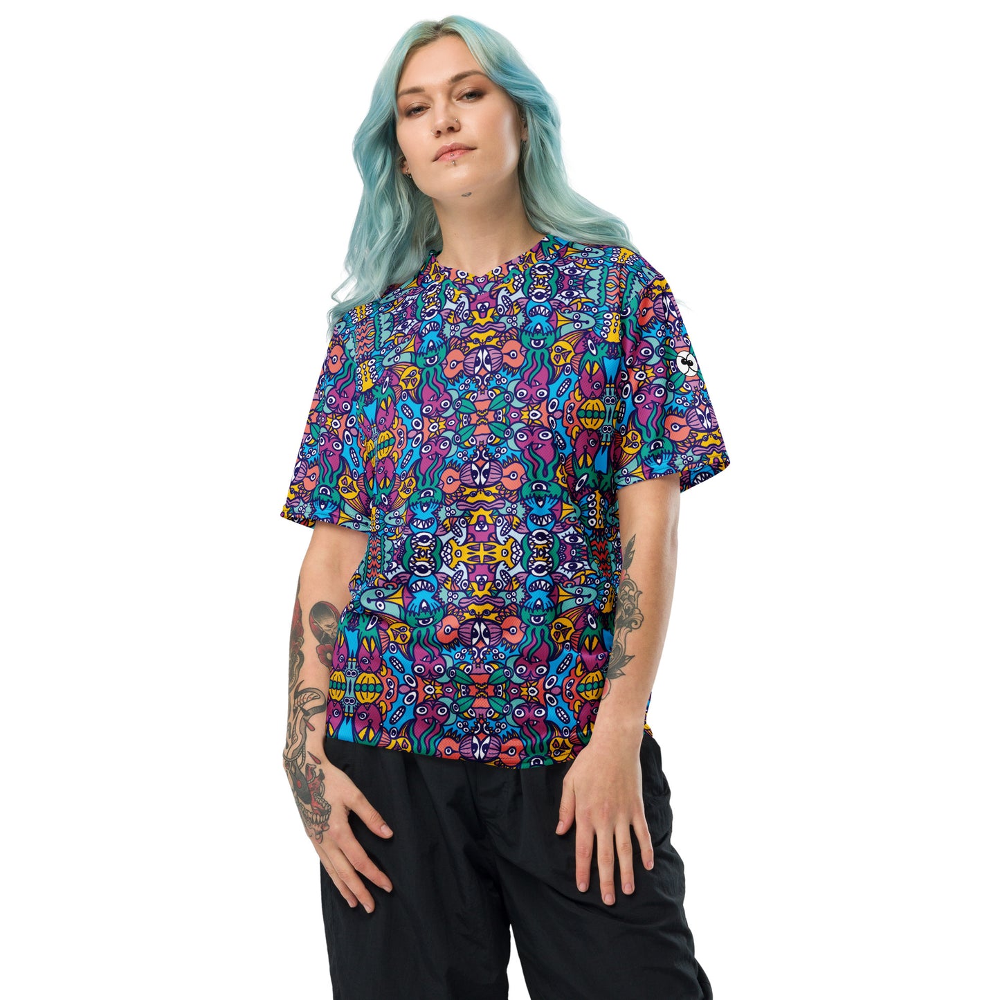 Woman wearing Whimsical design featuring multicolor critters from an alien world Recycled unisex sports jersey. Front view