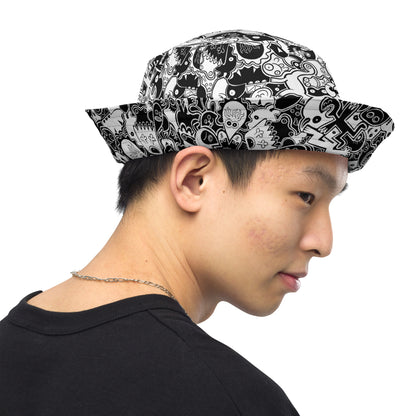 Joyful crowd of black and white doodle creatures Reversible bucket hat. Outside view