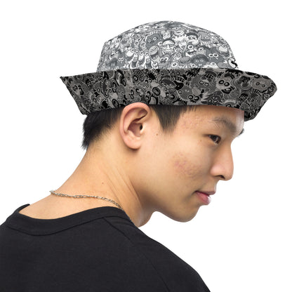 Find the gray man in the gray crowd of this gray world Reversible bucket hat. Outside view