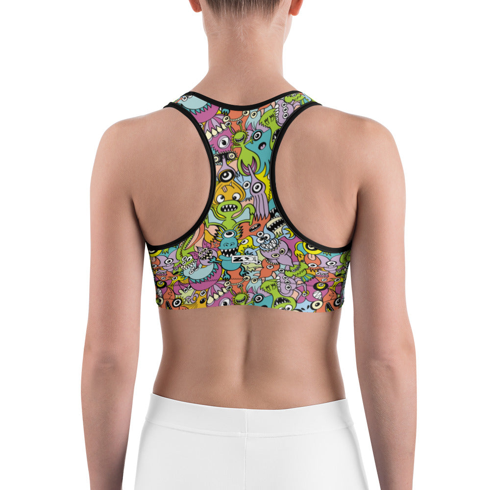 Funny monsters fighting for the best spot for a pattern design Sports bra
