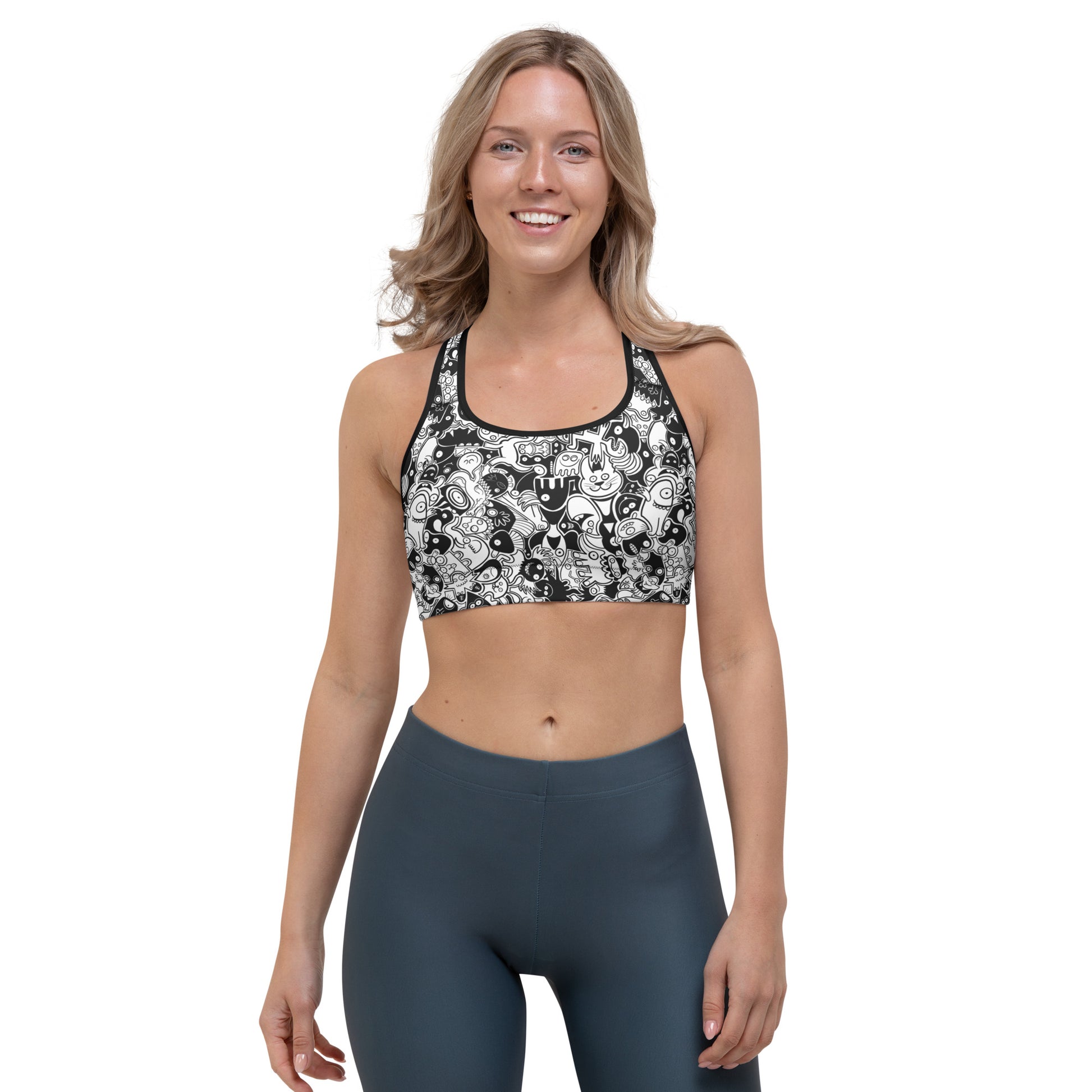 Joyful crowd of black and white doodle creatures Sports bra. Front view