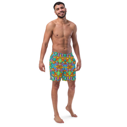 Smiling man wearing Swim Trunks All-over printed with Fantastic doodle world full of weird creatures