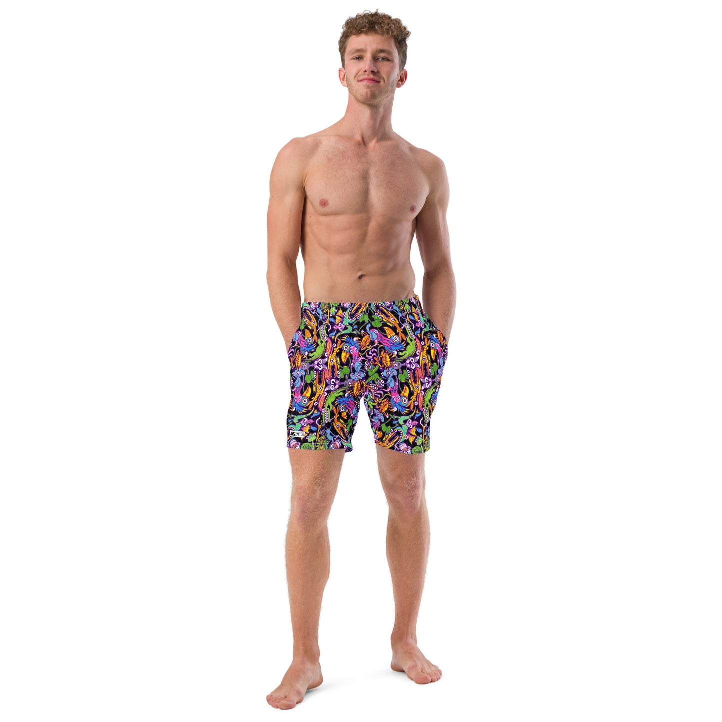 Young man wearing Swim Trunks All-over printed with Eccentric critters in a lively crazy festival