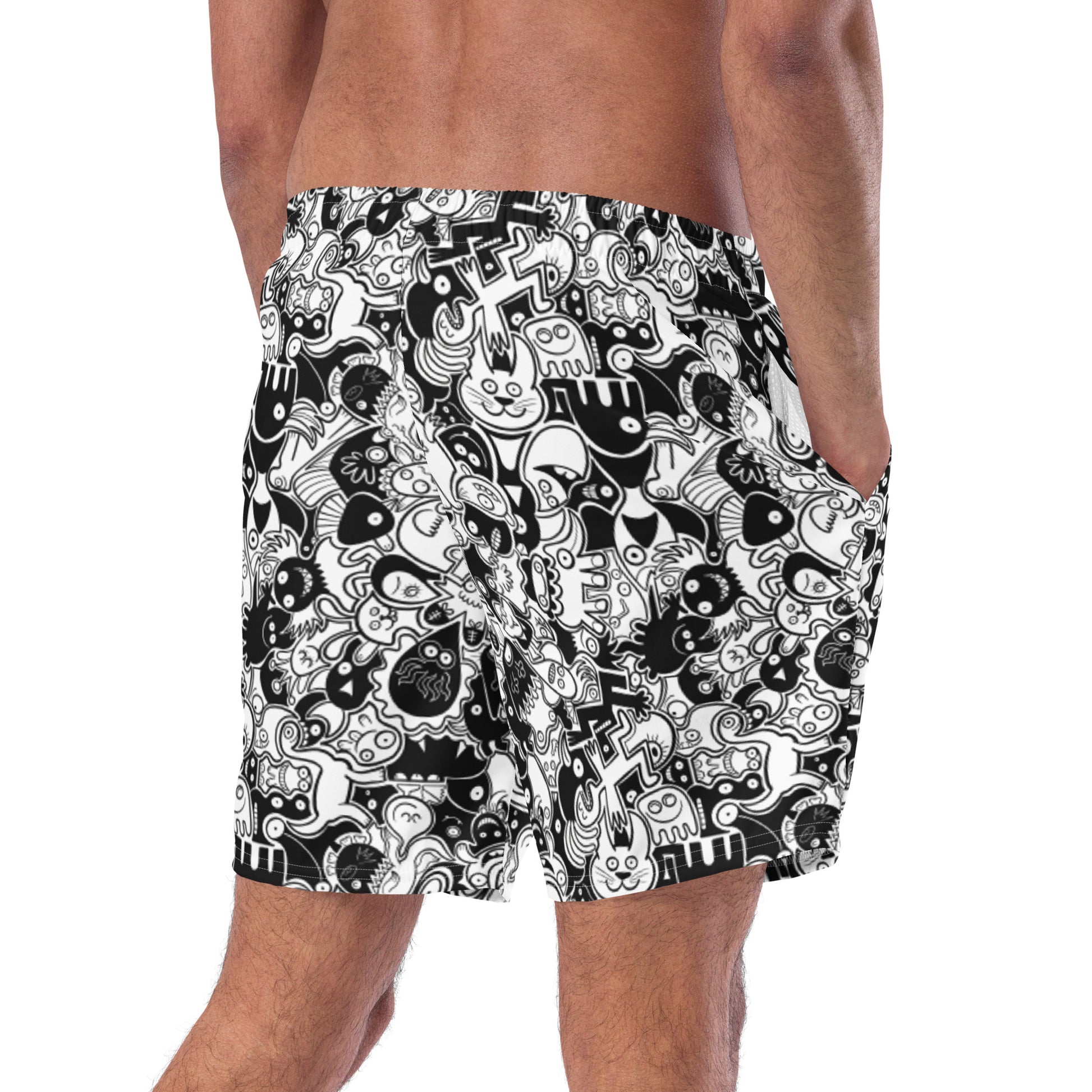 Joyful crowd of black and white doodle creatures Men's swim trunks. Back view