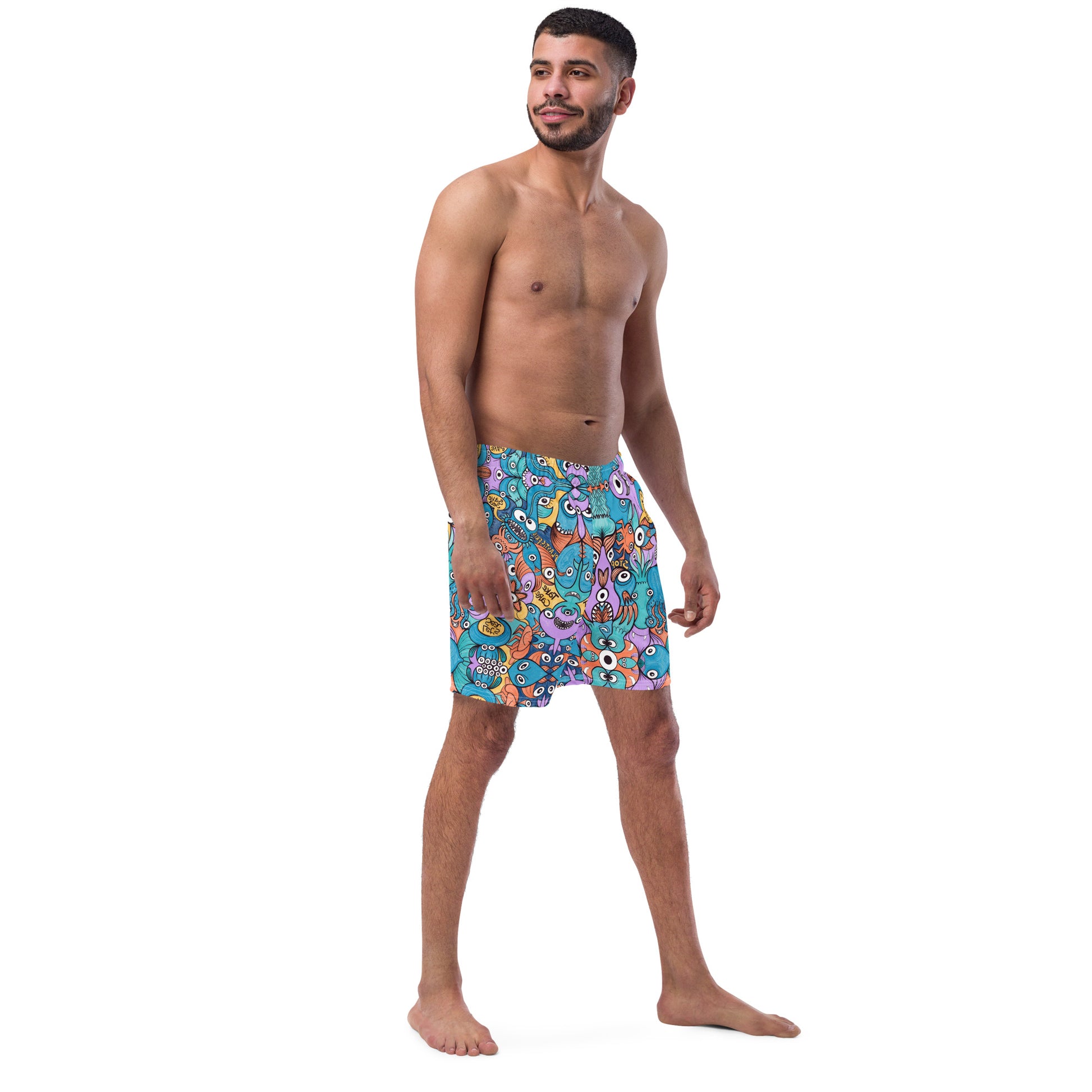 Young man wearing Men's swim trunks All-over printed with Wake up, time to take care of our sea