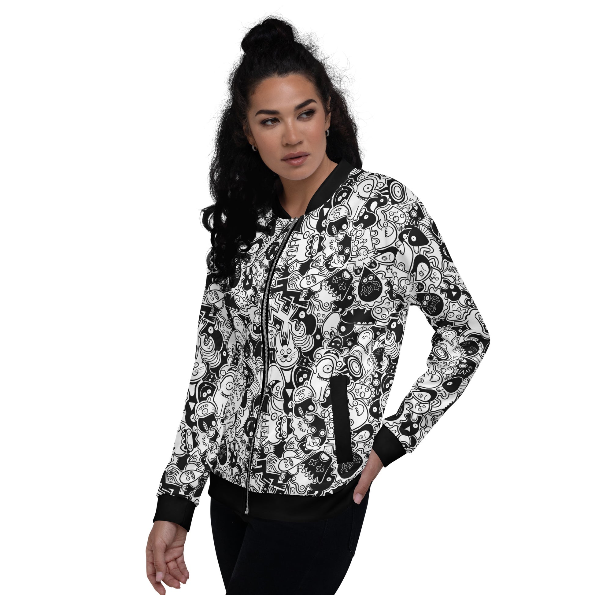 Nice woman wearing a Unisex Bomber Jacket All-over printed with Joyful crowd of black and white doodle creatures