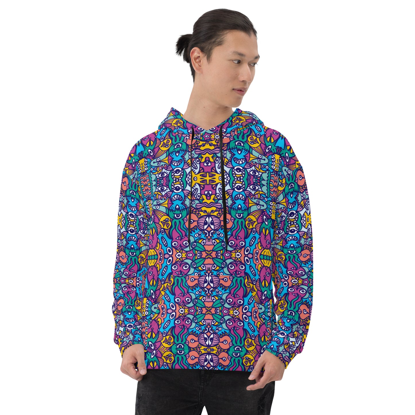 Young man wearing Unisex Hoodie All over printed with Whimsical design featuring multicolor critters from another world