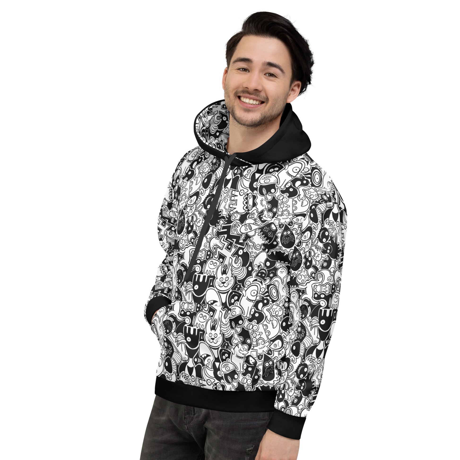 Smiling man wearing Unisex Hoodie All-over printed with Joyful crowd of black and white doodle creatures