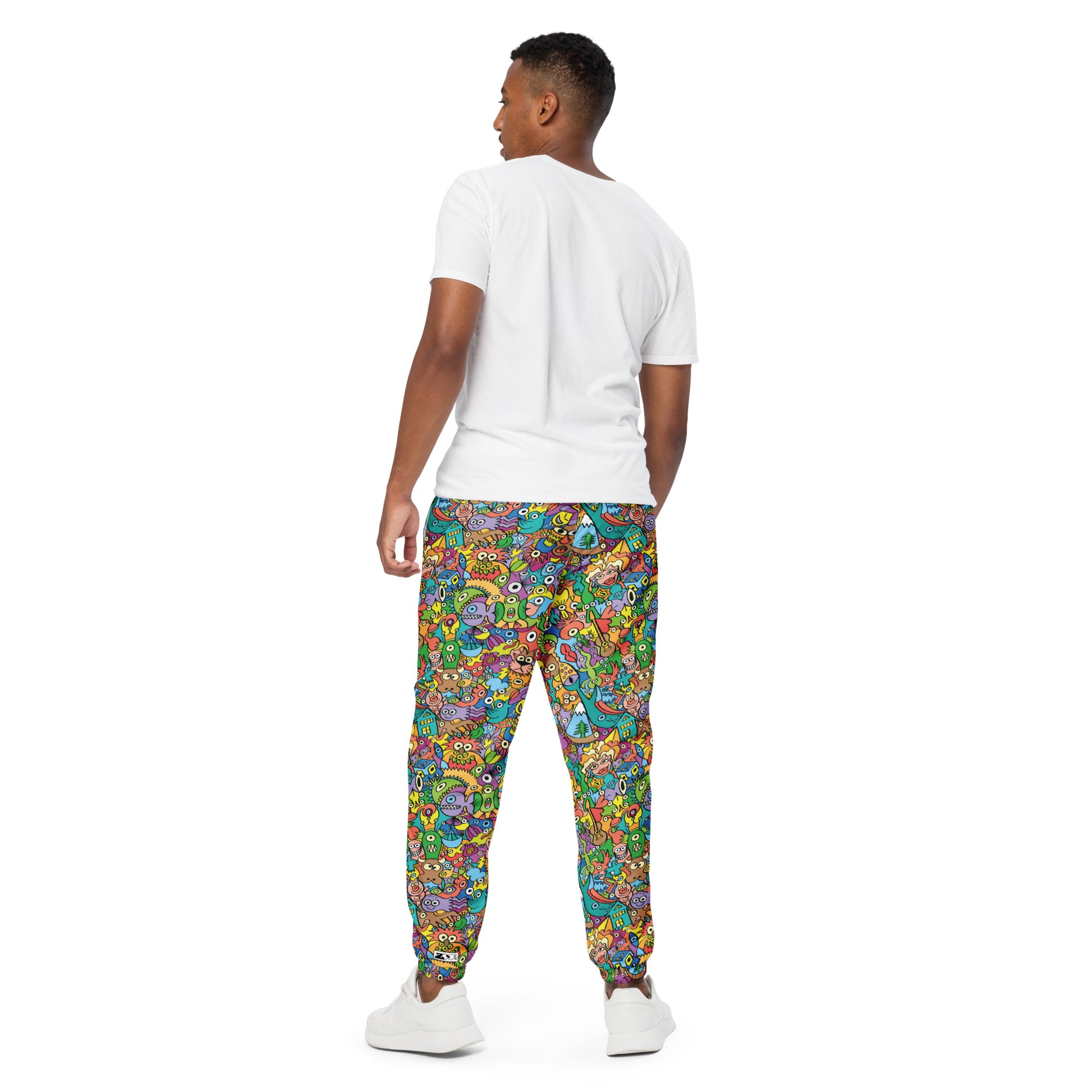Cheerful crowd enjoying a lively carnival Unisex track pants. Back view