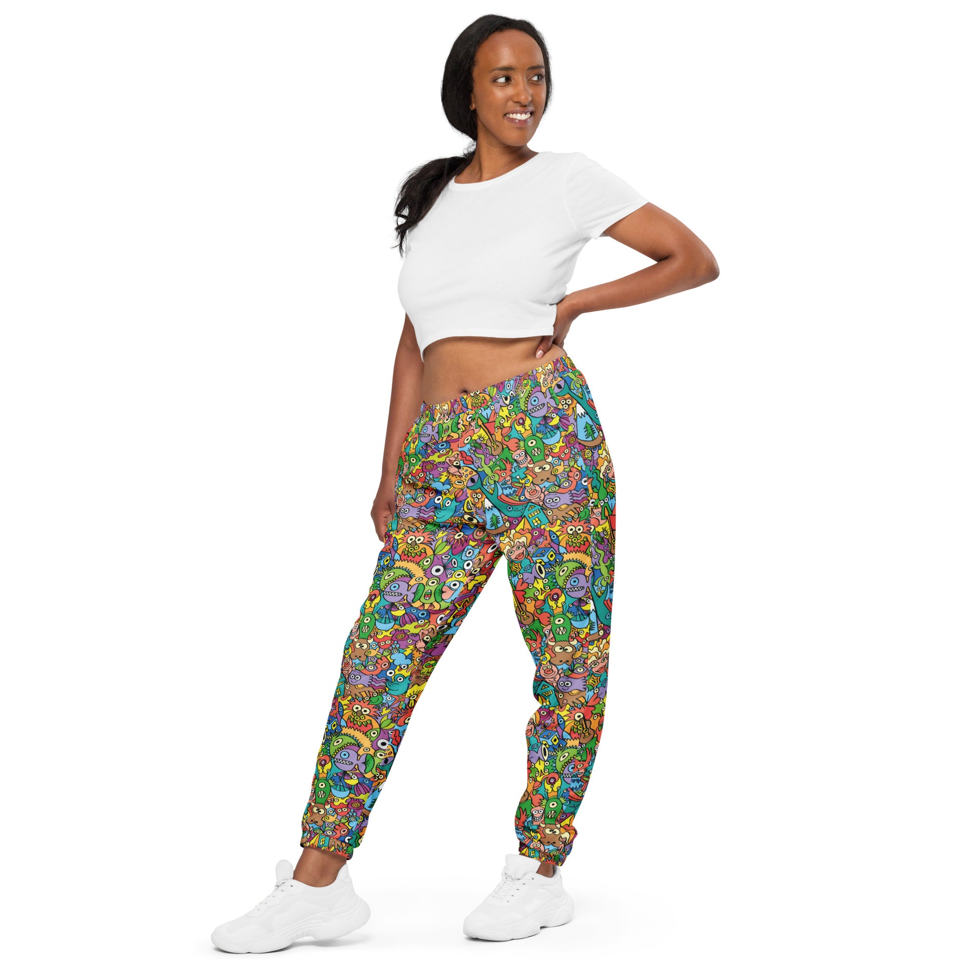 Cheerful crowd enjoying a lively carnival Unisex track pants. Front view