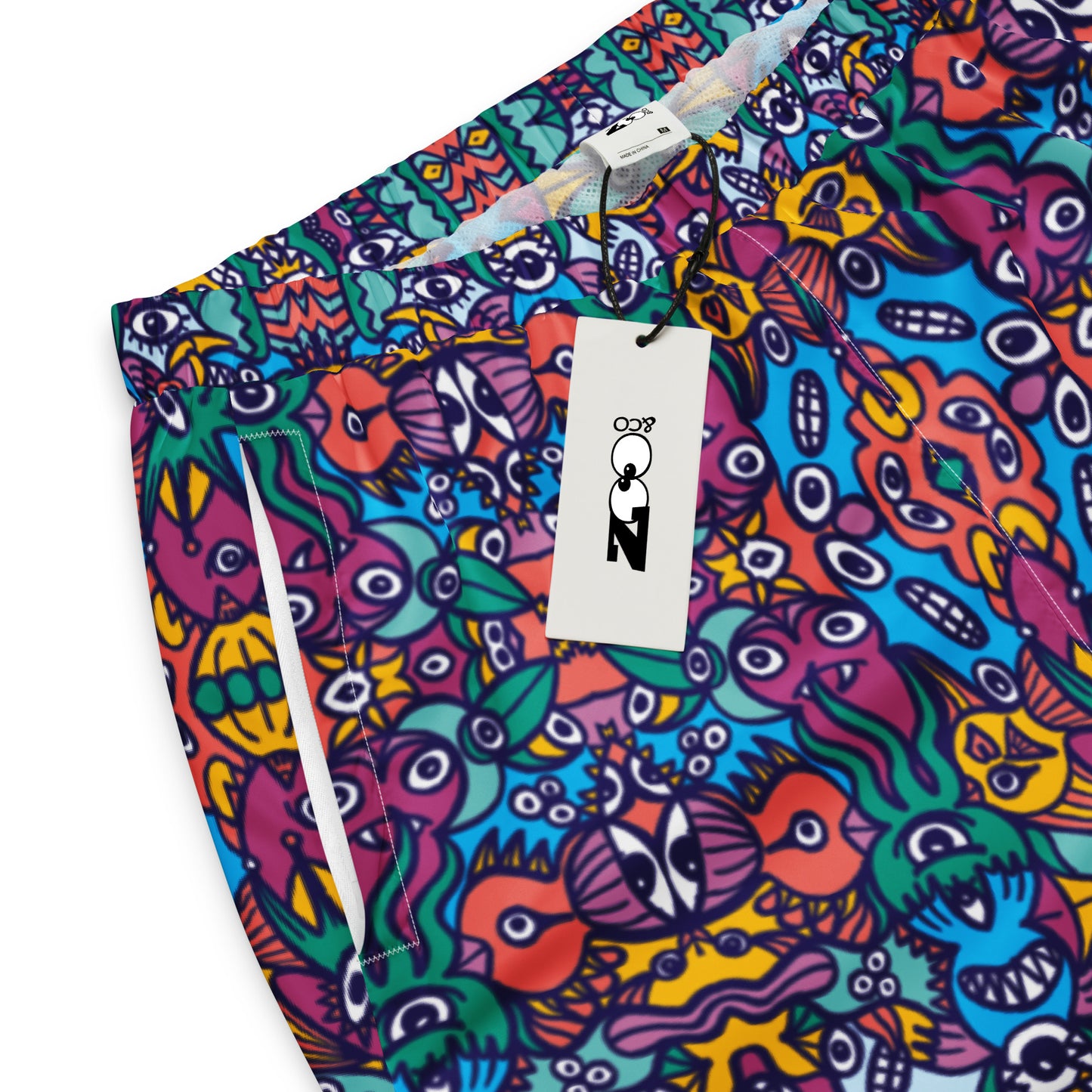 Whimsical design featuring multicolor critters from another world Unisex track pants. Product details