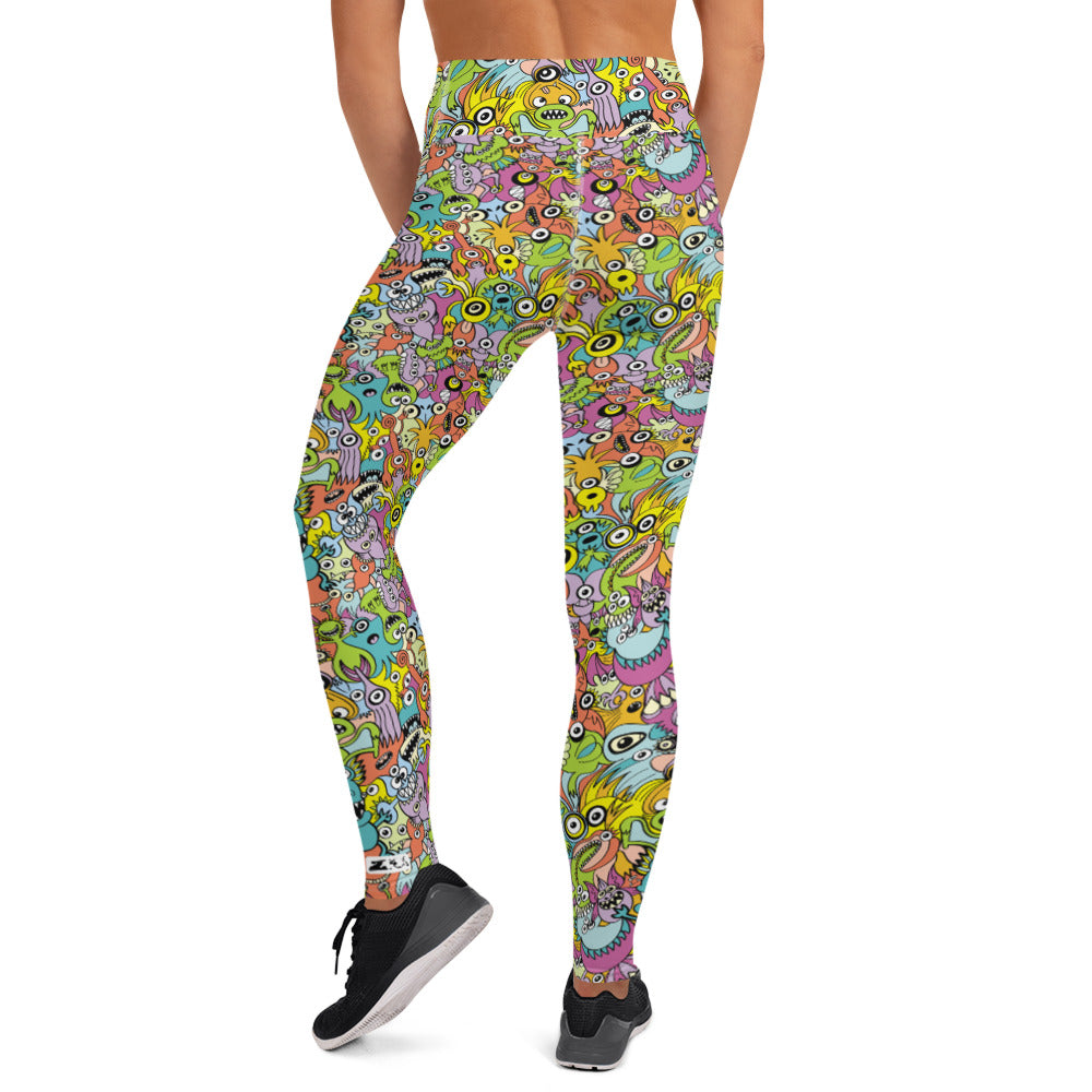 Funny monsters fighting for the best spot for a pattern design Yoga Leggings. Back view