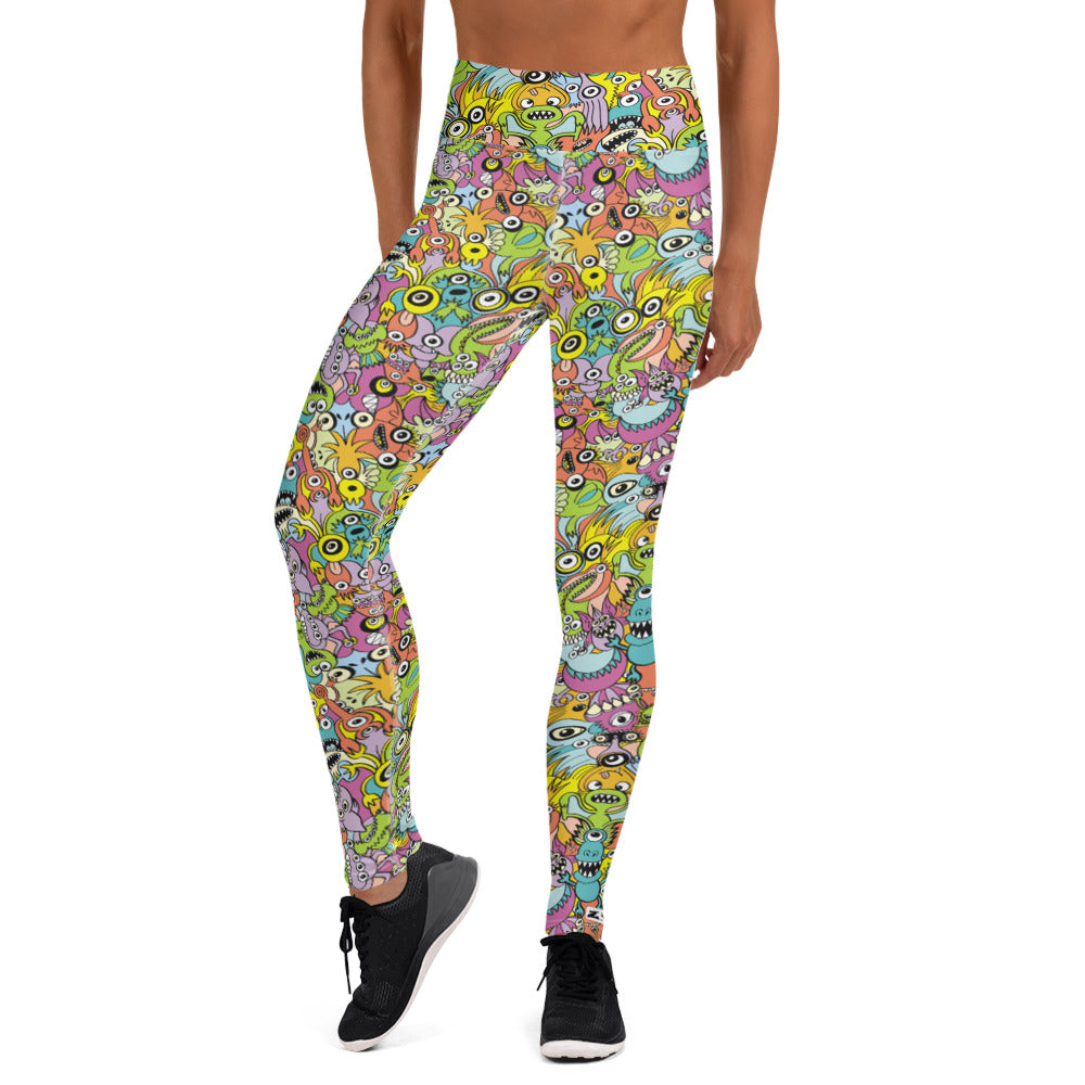 Funny monsters fighting for the best spot for a pattern design Yoga Leggings. Front view