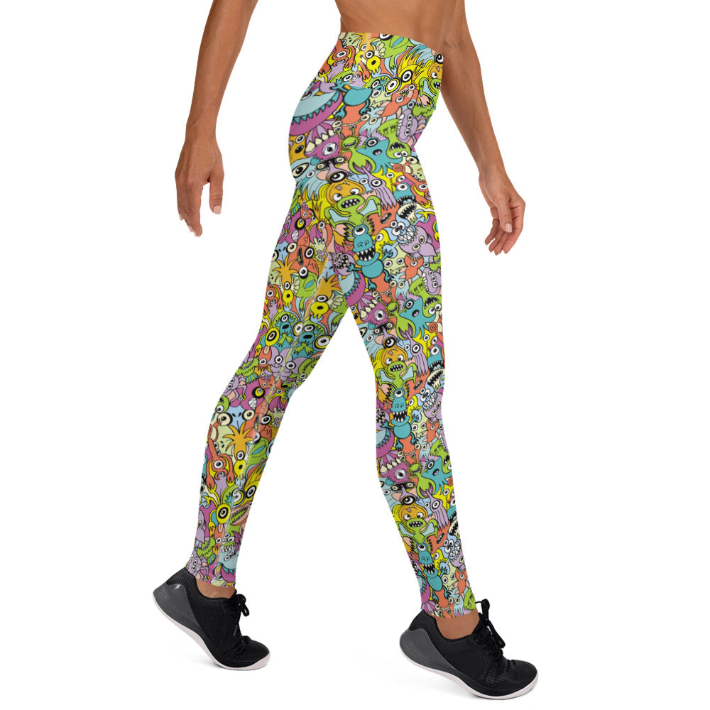 Funny monsters fighting for the best spot for a pattern design Yoga Leggings. Side view