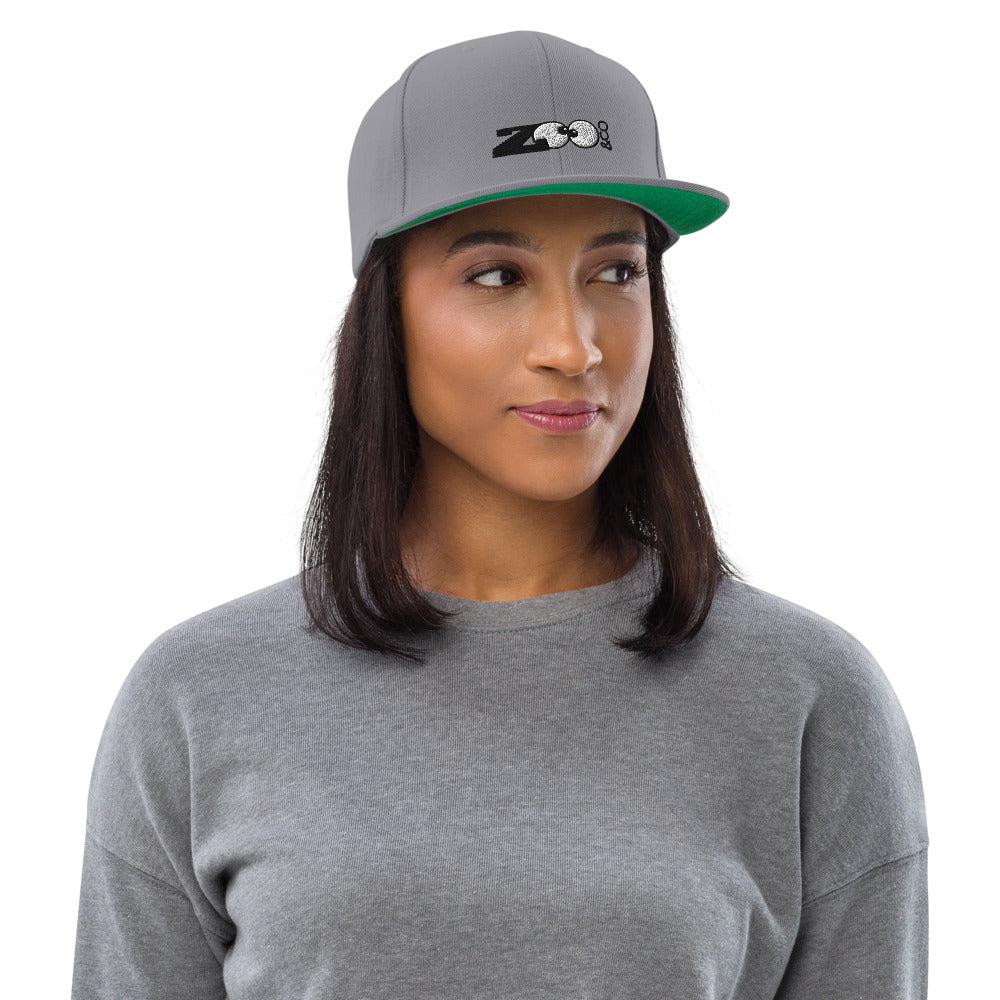 Beautiful woman wearing a Zoo&co branded Snapback Hat. Silver