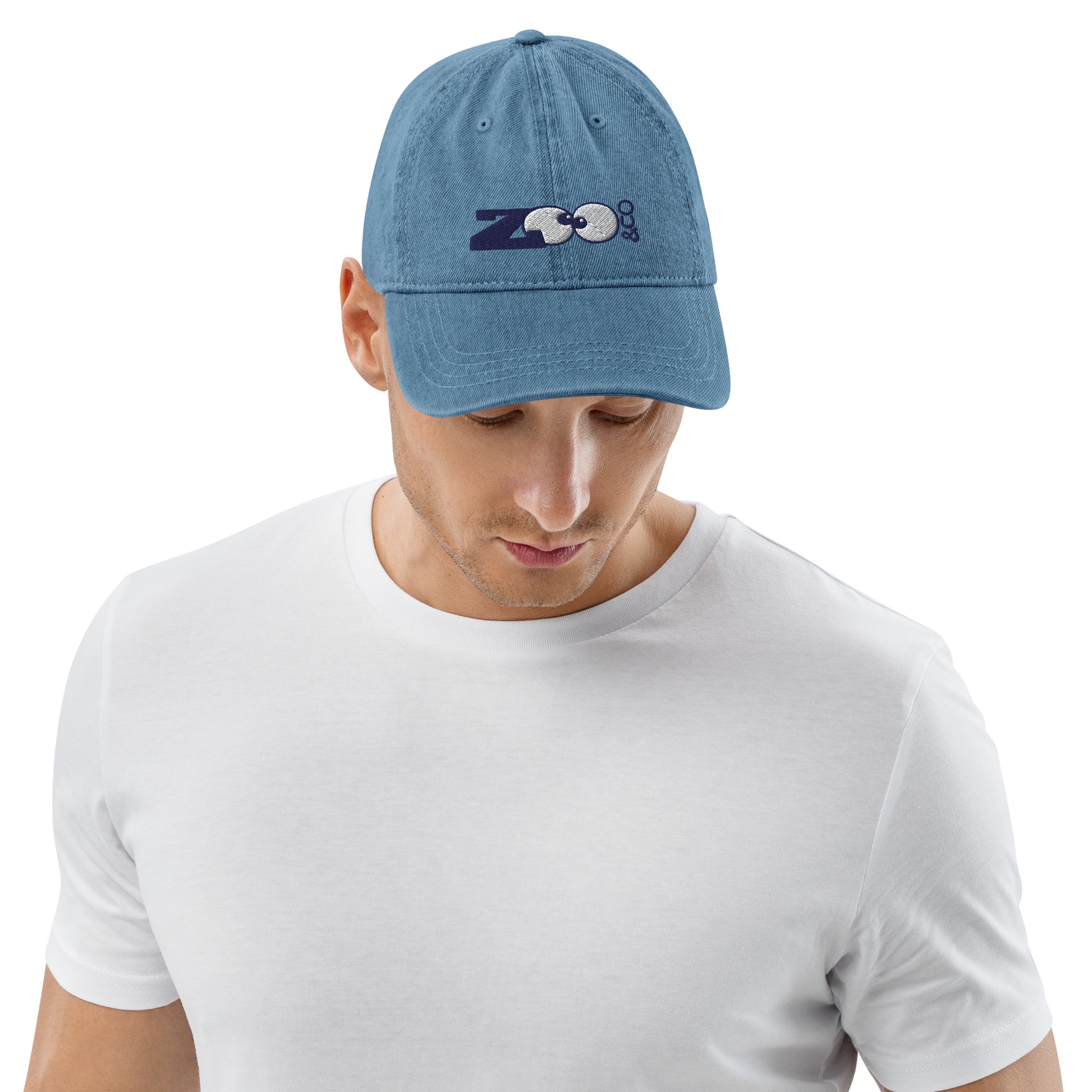 Young man wearing Blue Denim Hat embroidered with Zoo&co's logo