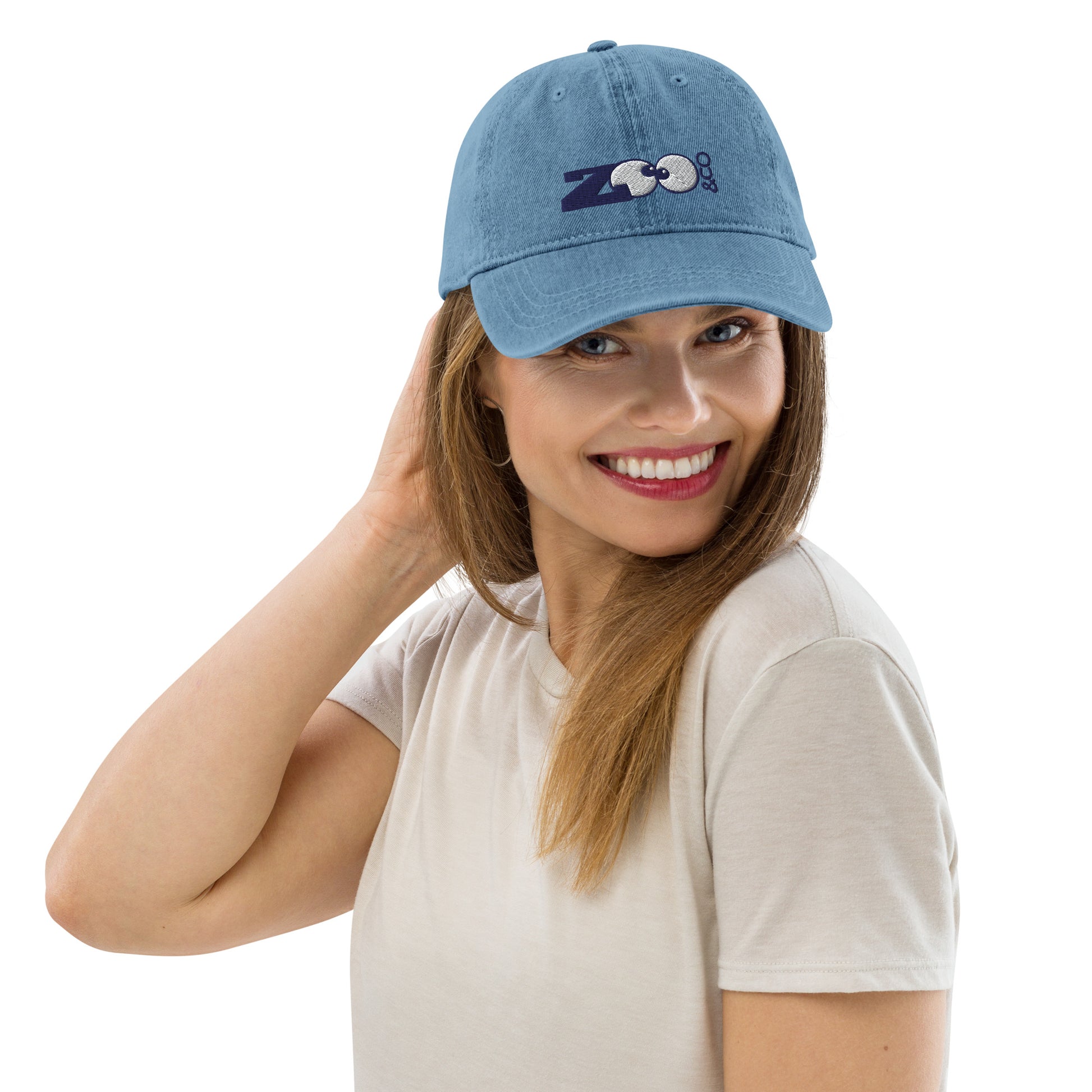 Smiling woman wearing Blue Denim Hat embroidered with Zoo&co's logo