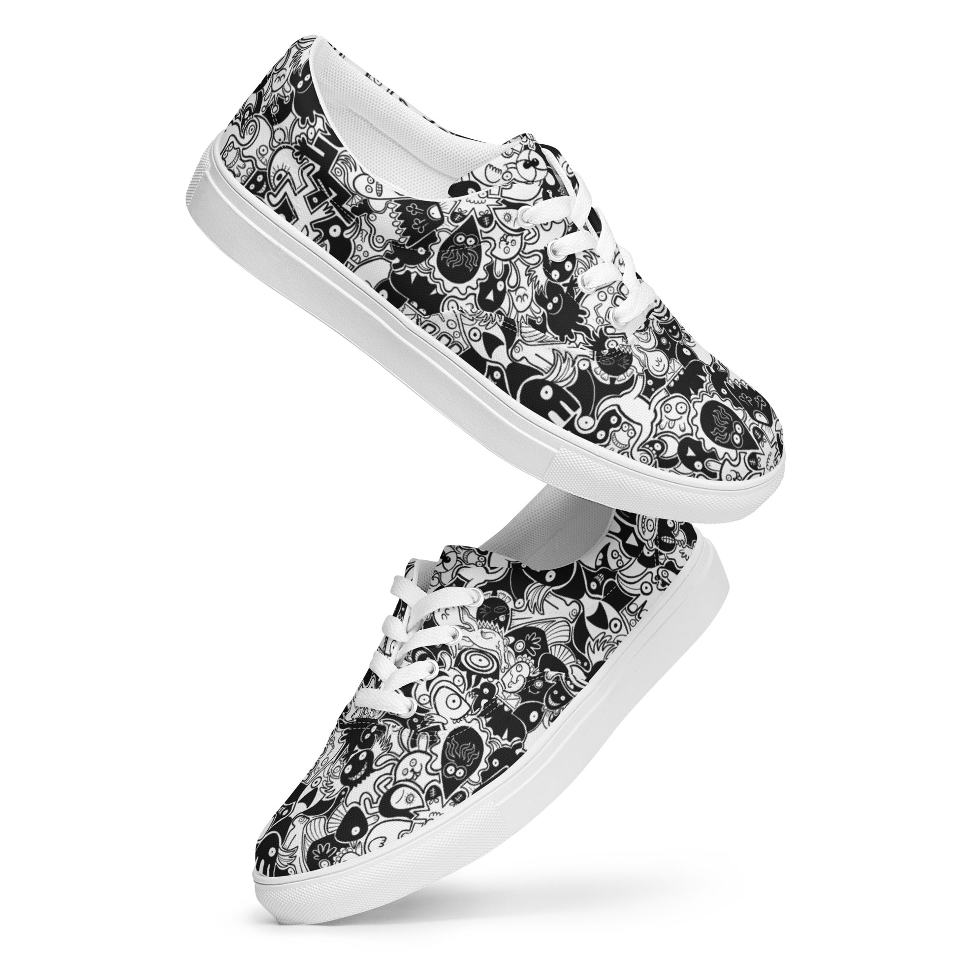 Joyful crowd of black and white doodle creatures Men’s lace-up canvas shoes. Playing with shoes