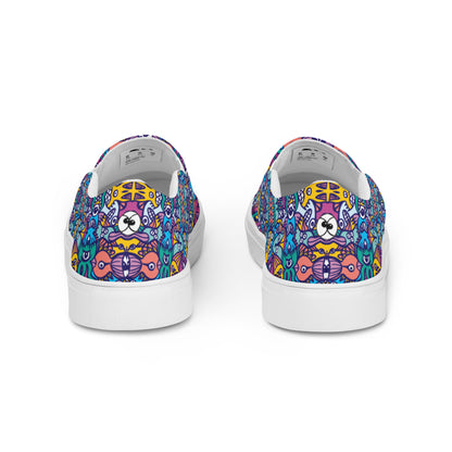 Whimsical design featuring multicolor critters from another world Men’s slip-on canvas shoes. Back view