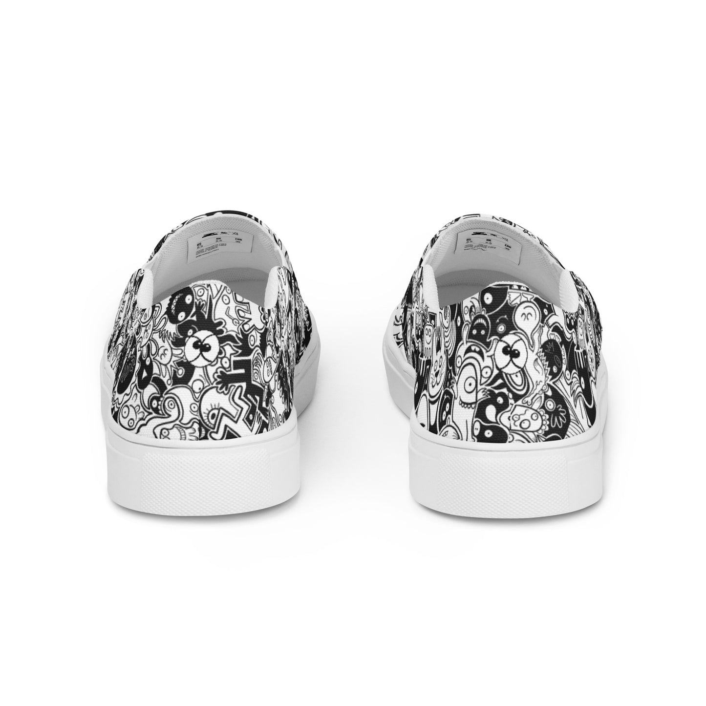 Joyful crowd of black and white doodle creatures Men’s slip-on canvas shoes. Back view
