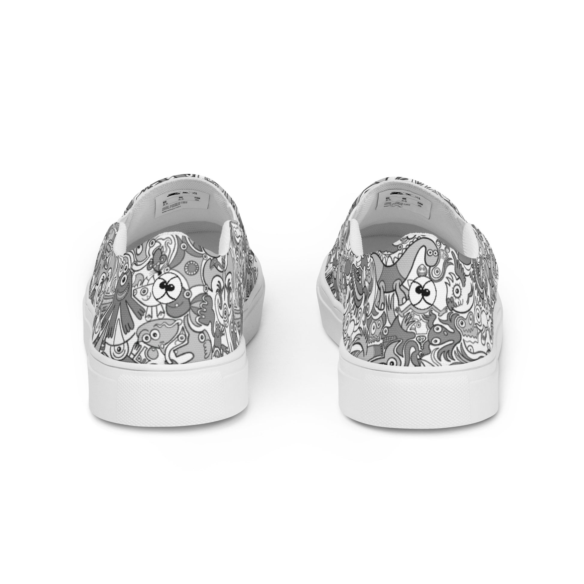 Awesome doodle creatures in a variety of tones of gray Men’s slip-on canvas shoes. Back view