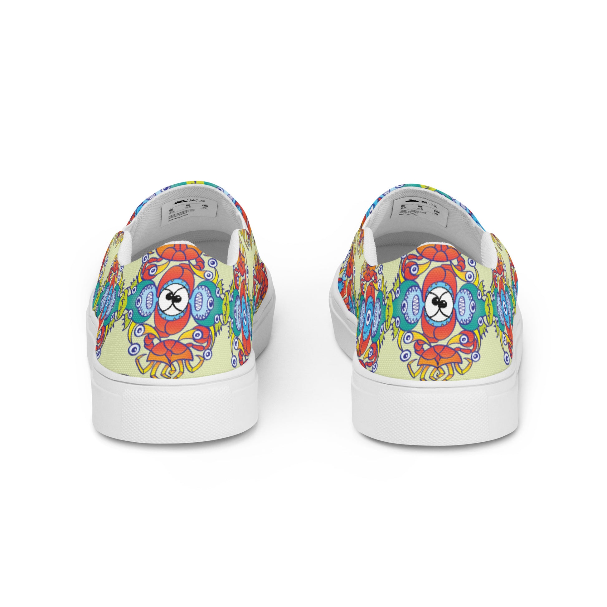 Crabs, octopuses and fish from a tropical sunny beach Men’s slip-on canvas shoes. Back view