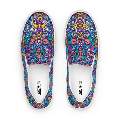 Whimsical design featuring multicolor critters from another world Men’s slip-on canvas shoes. Top view