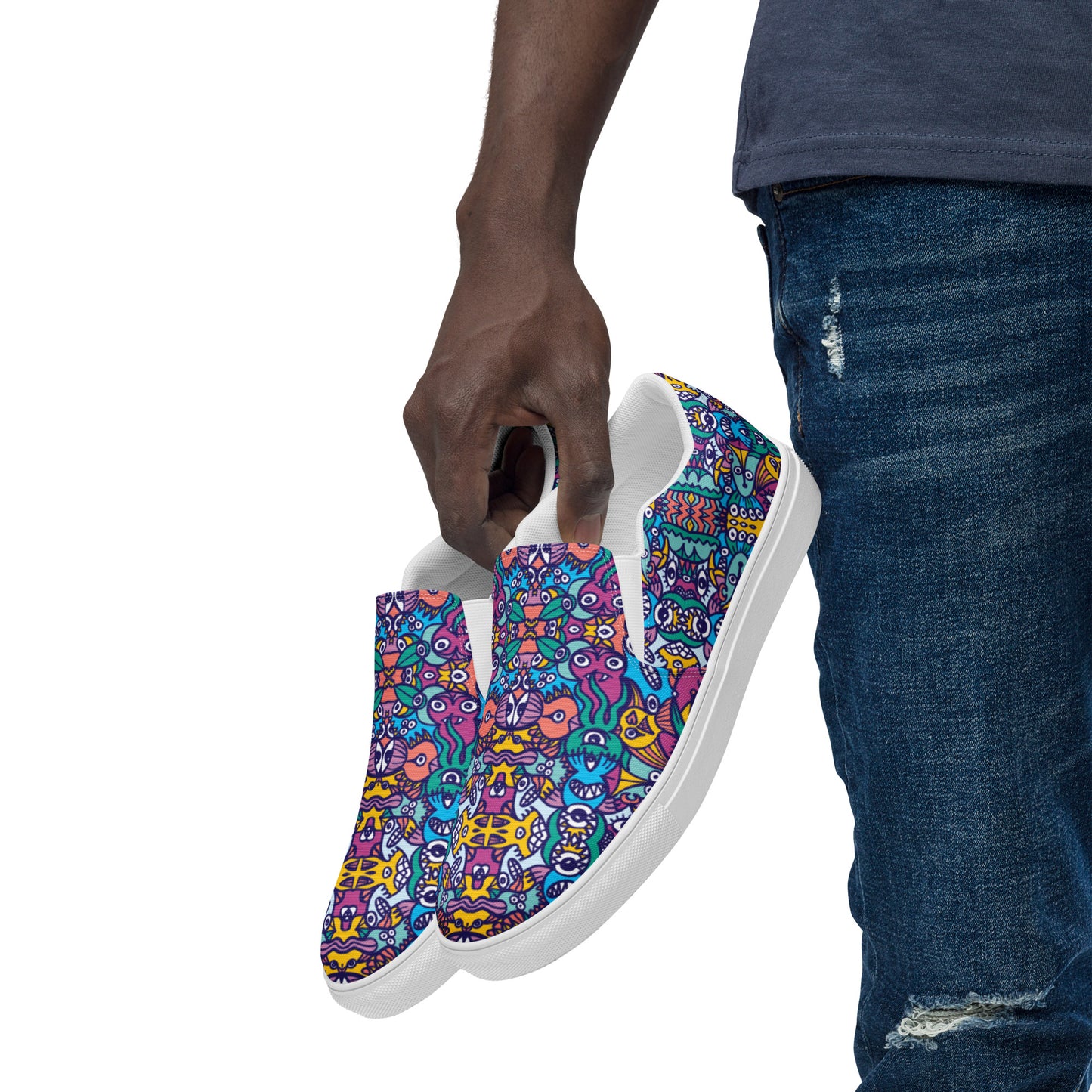Whimsical design featuring multicolor critters from another world Men’s slip-on canvas shoes. Lifestyle