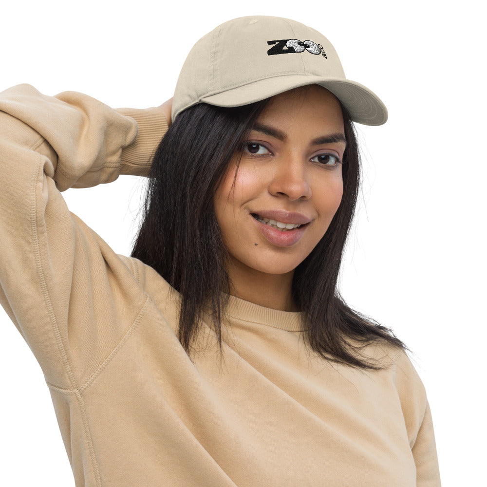 Nice woman wearing a Zoo&co branded Organic dad hat. Oyster. Front view