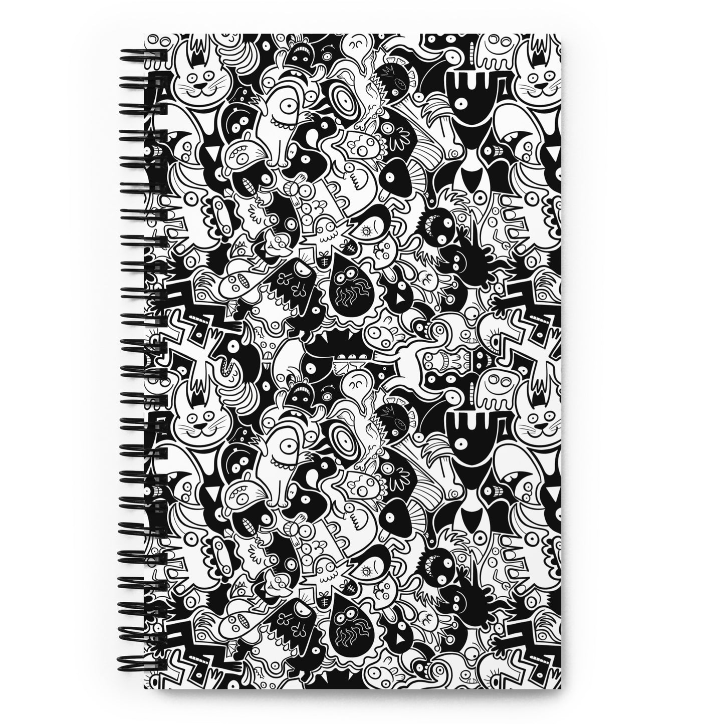 Joyful crowd of black and white doodle creatures Spiral notebook. Front view