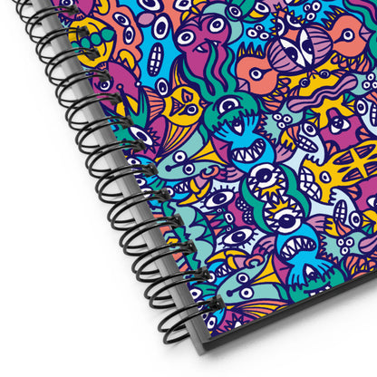 Whimsical design featuring multicolor critters from another world Spiral notebook. Product detail