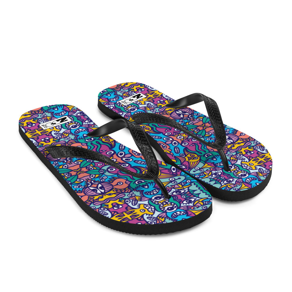 Whimsical design featuring multicolor critters from another world Flip-Flops. Overview